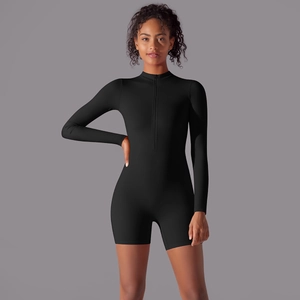 Detail of front zipper and stand collar on a black long sleeve athletic bodysuit