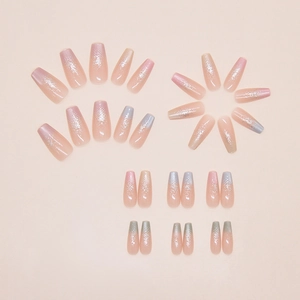 Detailed flat lay of pink gradient coffin press-on nails with silver glitter sparkles