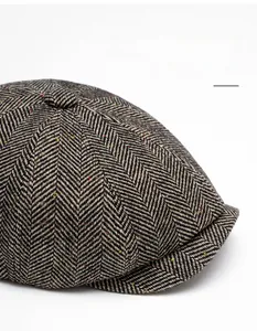 Detail of herringbone wool blend fabric with colorful neps on a vintage newsboy cap