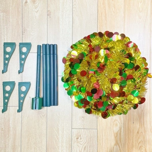Detailed view of collapsible Christmas tree kit with tinsel body and assembly parts
