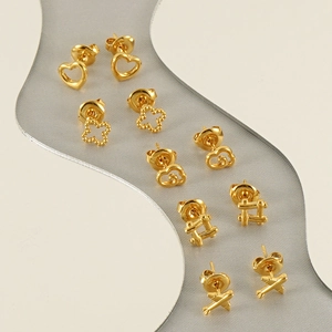Golden stud earring set for women featuring heart clover and geometric designs