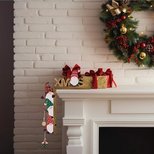 Detailed view of wood XMAS letter signs and gnome ornaments in a cozy Christmas setting