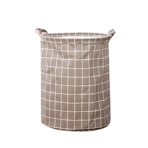 Collapsible gray lattice laundry hamper made of canvas fabric with sturdy double handles