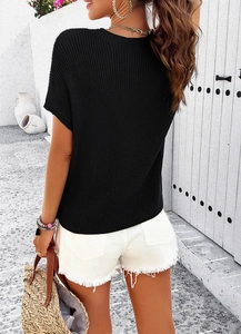 Back view of a black short sleeve knit top with textured fabric and a casual resort style