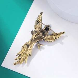 Detailed back view of a vintage eagle brooch showing the secure metal safety pin closure