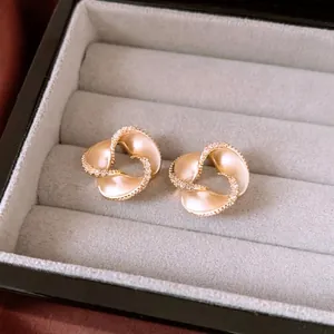 14K gold plated abstract petal earrings with micro-inlaid zircons on velvet box