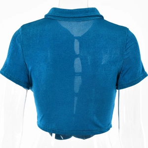 Detail view of the back of a blue short-sleeve polo crop top with fine ribbed texture