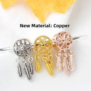 Detailed copper dreamcatcher pendants with heart mesh and feathers in silver, gold, and rose gold