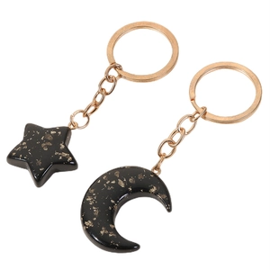 Acrylic star and moon couple keychain with gold glitter in black resin finish