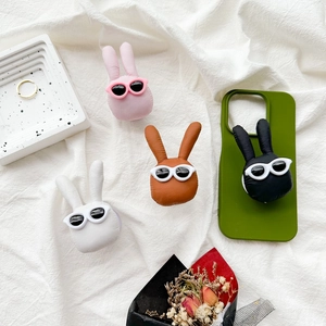 Cute bunny phone grip with sunglasses on a green case, available in four colors