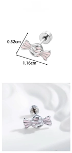 Macro detail of silver candy stud earring with pink enamel and sparkling zircon stone