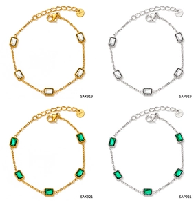 Detail view of gold and silver zircon bracelets with S.STEEL charms and lobster clasps