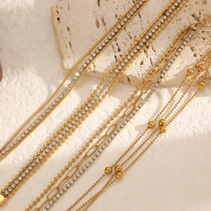 Multilayer gold stainless steel bracelet with sparkling rhinestones on textured stone