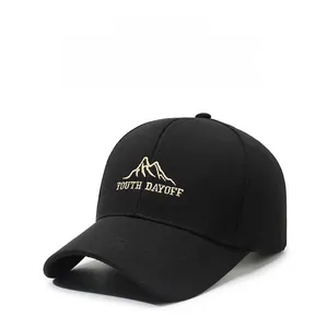 Detail of black baseball cap featuring mountain embroidery and Youth Dayoff text