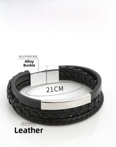 Detail of multi-layer black braided leather bracelet with silver metal buckle and 21cm length