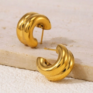 Double-layered C-shaped 18K gold plated earrings with diamonds on a stone base