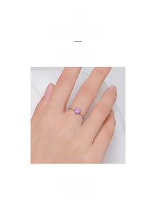 Detail of pink heart-shaped opal set on a delicate 925 silver chain ring band