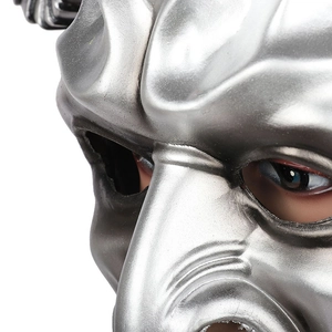 Macro shot of metallic silver 3D mask showing intricate eye detail and polished finish