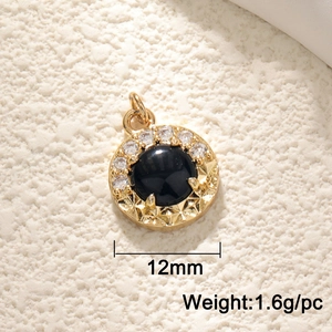 Detailed view of a 12mm black gemstone pendant in gold frame showing weight and size