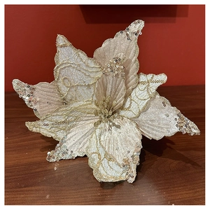 Champagne glitter Christmas flower with gold sequins and detailed fabric texture macro