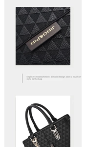 Detail of black patchwork tote bag featuring triangle quilting and silver hardware