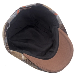 Detail view showing the black inner lining and origin label of the plaid wool beret hat