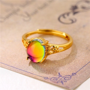 Elegant gold open ring featuring a colorful rainbow gemstone in a vintage minimalist style