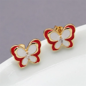 Close-up of red and white enamel butterfly stud earrings with center crystal accent