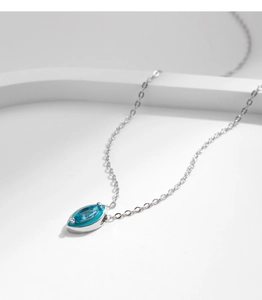 Close-up of marquise-cut turquoise gemstone pendant on a 925 sterling silver chain