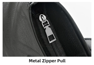 Macro shot of silver metal zipper detail on black lychee grain leather tote bag