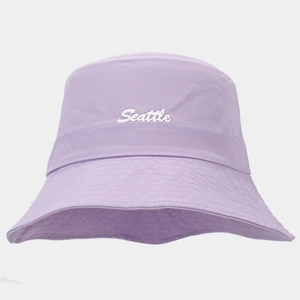 Close-up of a purple bucket hat featuring white Seattle embroidery and reinforced stitching