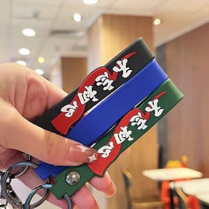 Handheld PVC soldier keychain set in black, blue, and green with embossed metal rings