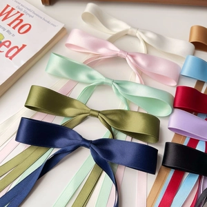 Colorful satin ribbon bow hair clips set for women on a clean white background