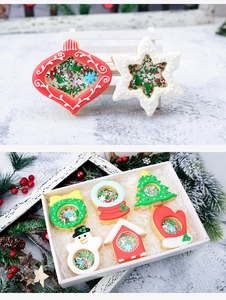 Detailed view of Christmas cookie cutters with sugar windows and colorful bead fillings