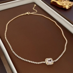 Detail of gold-plated square zircon necklace with lobster clasp and adjustable chain