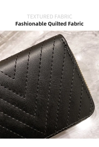 Close-up of black V-quilted textured fabric and neat stitching on a women short wallet