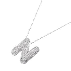 Close-up of balloon letter N pendant necklace with pavé cubic zirconia in silver finish