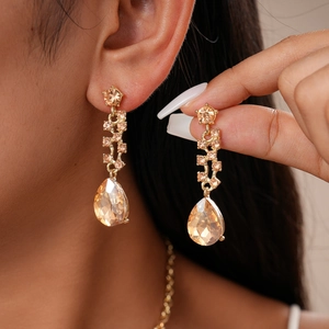 Elegant champagne gold floral teardrop earrings and necklace set with luxury crystals