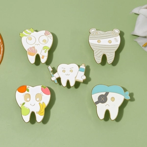 Set of five creative cartoon teeth enamel pins featuring dessert, pirate and fruit designs