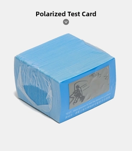 Stack of blue polarized test cards with patterns for checking sunglass lens quality