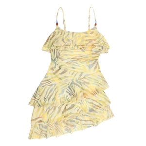 Detail of yellow floral dress with beaded straps and layered ruffle hemline