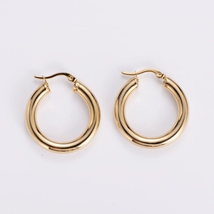 Detailed view of polished 18k gold hollow hoop earrings with secure hinge closures