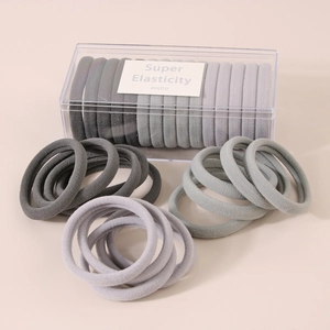 Close-up of Morandi colored high elasticity hair ties with a clear storage box