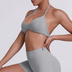 Close-up of seamless gray ribbed halter sports bra and high-waist fitness shorts