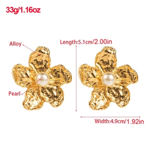 Detail view of gold leaf earrings with white pearl including size and weight specs