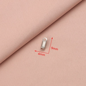 Macro shot of 9mm x 4mm silver stainless steel cord end cap connector for DIY jewelry