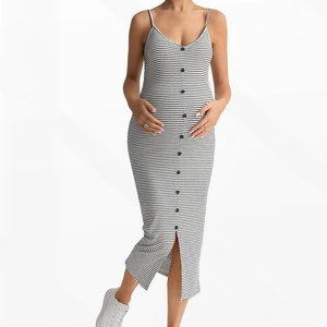 Detail of striped maternity dress featuring a ribbed knit texture and button decoration