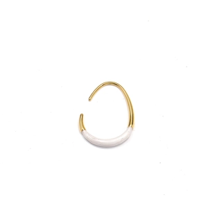Detailed close-up of 18K gold-plated U-shaped earrings with cream enamel finish