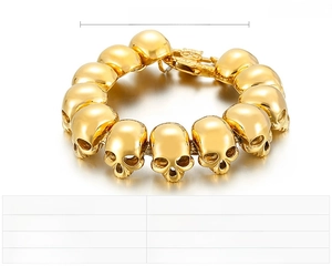 Detailed view of the gold-toned stainless steel skull head bracelet showing links