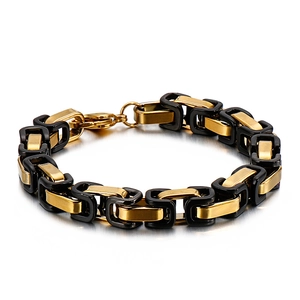 Minimalist gold and black stainless steel chain bracelet with lobster clasp on white background
